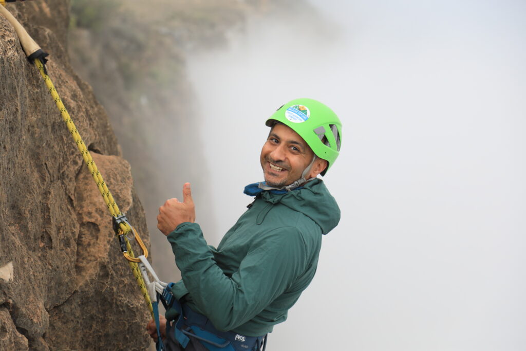 Abseiling in Salalah Oman at Jabal Samhan mountain adventure experience
