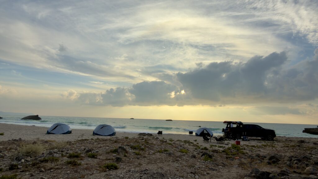 Luxury beach camping Al Fazayah Salalah Oman sunset private tents seaside relaxation
