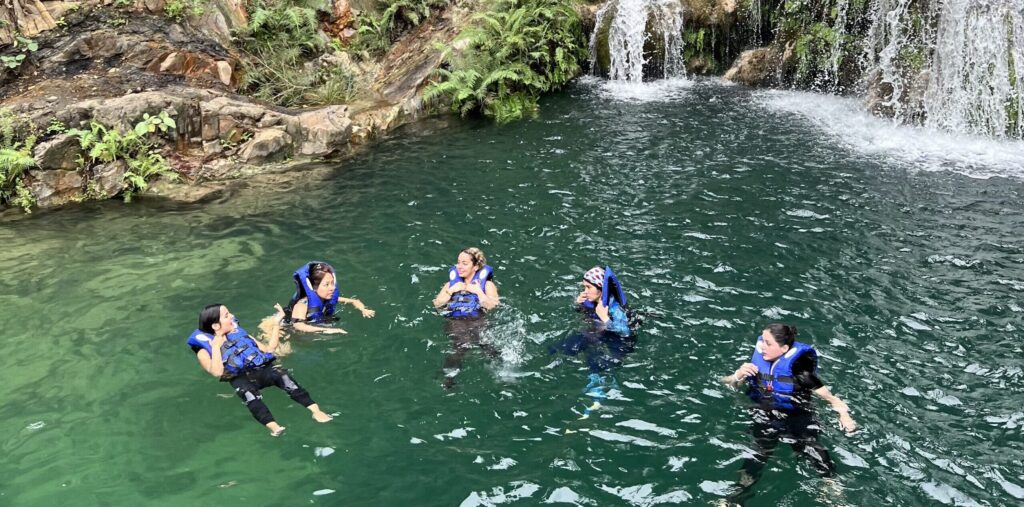 Swimming under waterfalls in Salalah Oman – guided hiking and nature adventure trip