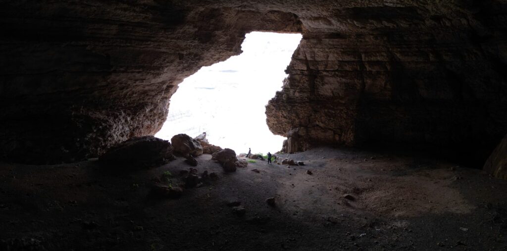 Teeq Cave hiking experience in Salalah Oman with natural rock cave and scenic mountain views