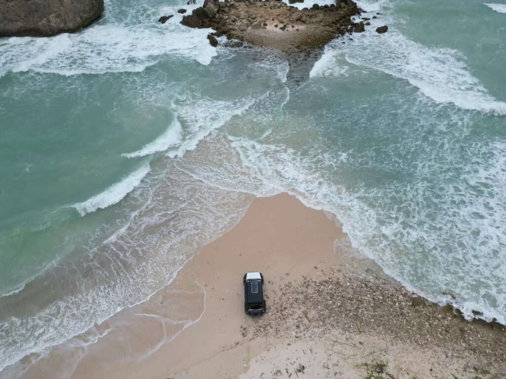 Al Fazayah Beach Salalah Oman aerial view turquoise waves sandy beach coastal landscape Dhofar