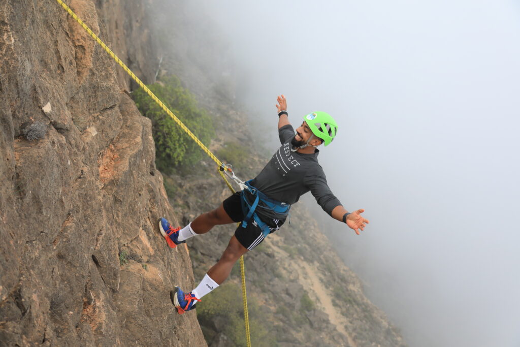 Abseiling in Salalah Oman cliff adventure with safety gear and guide