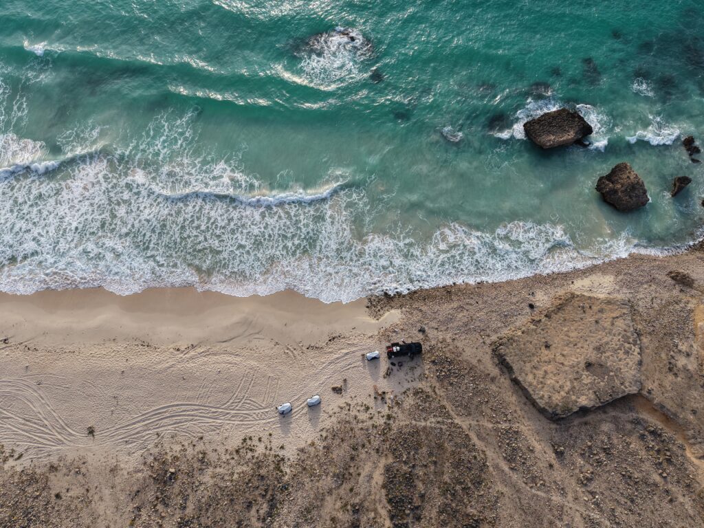 Salalah Oman beach camping and hiking adventure with turquoise sea and scenic coastline