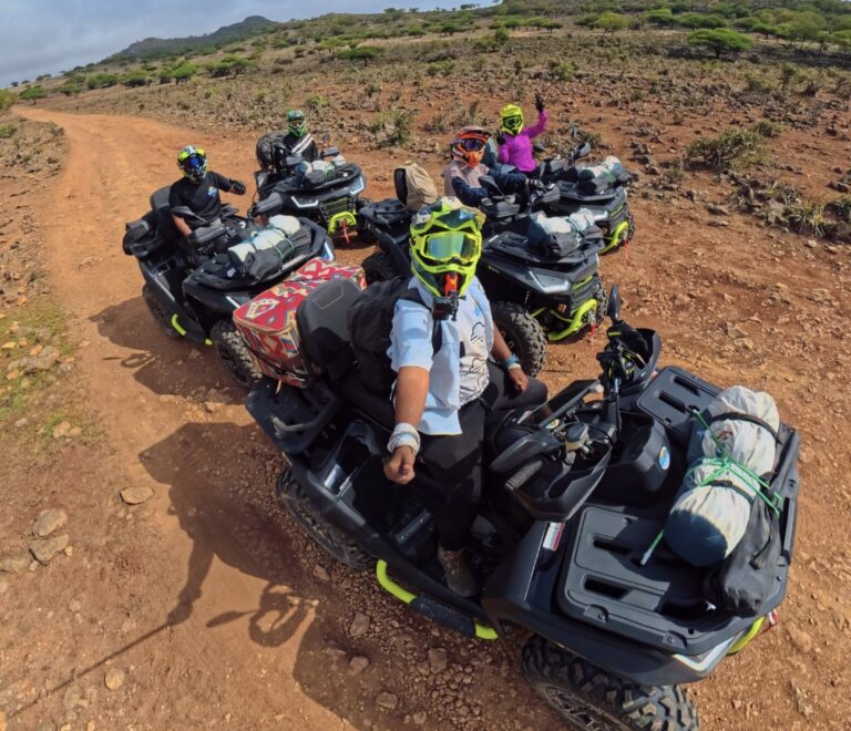 Riders enjoying a guided quad bike camping adventure in the mountains of Salalah, Oman.